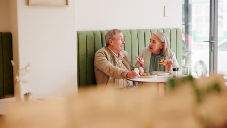 elderly couple enjoying lunch in a cafe