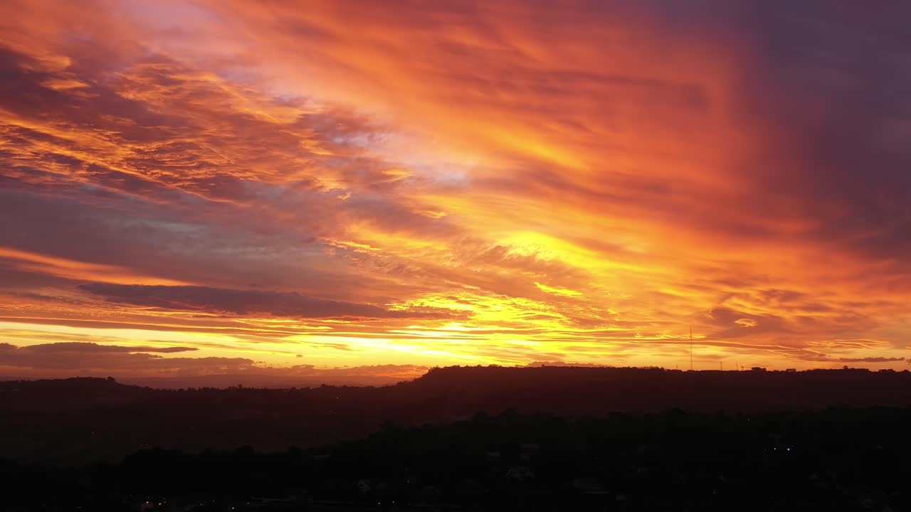 Aerial panoramic view of breathtaking sunset over hills