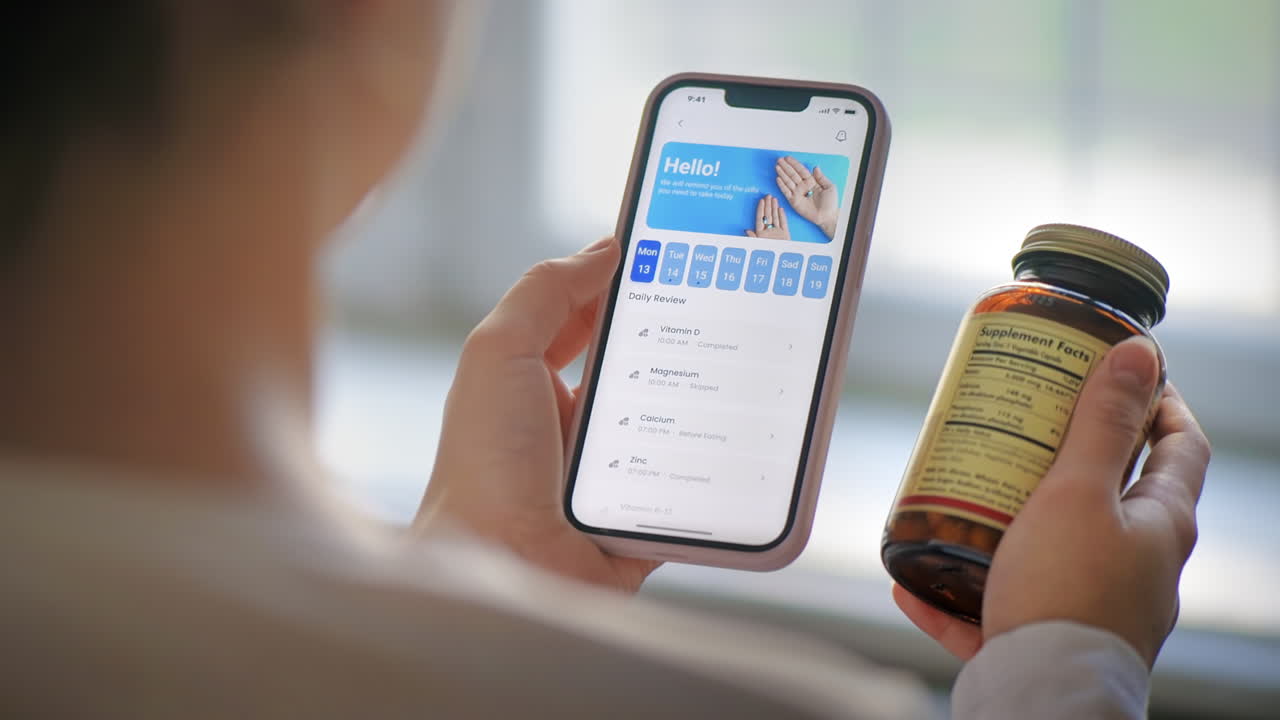 Person using mobile app with vitamins