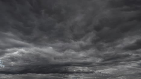 background of dark dramatic sky with stormy clouds timelapse before rain or snow, extreme weather
