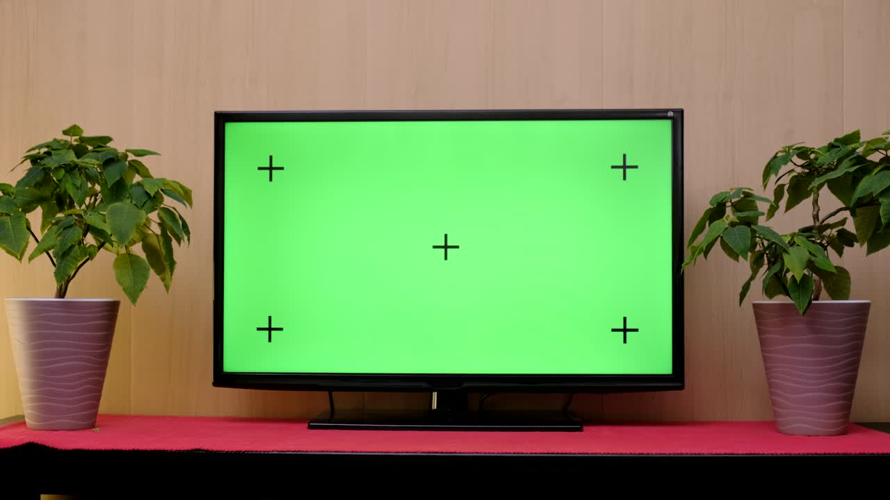 TV with green screen composited. TV or television - green screen - room - on the table.
