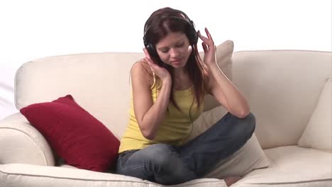 stock video of woman listening to music