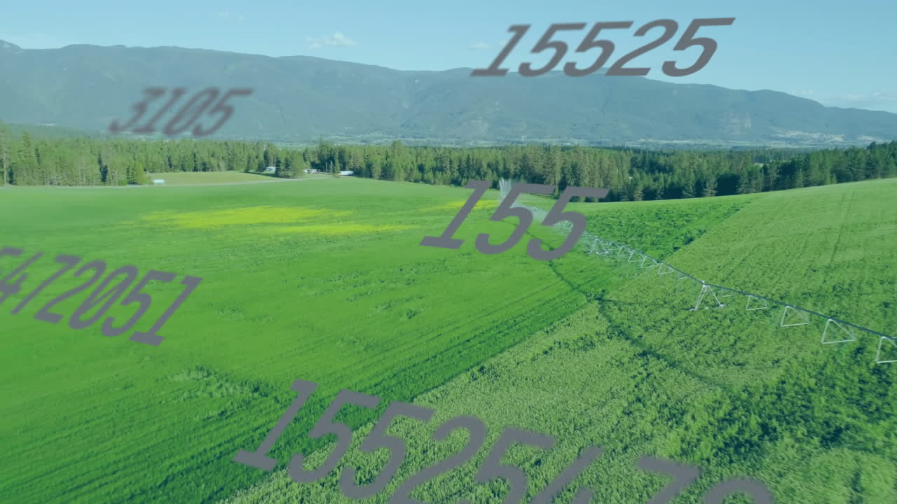 Center pivot irrigation system animating across green crop fields showing numeric data overlay
