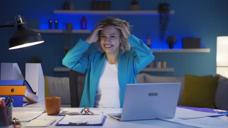 Home-office-worker-woman-dances-looking-at-camera.