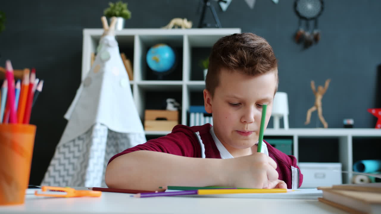 Boy Coloring at Desk