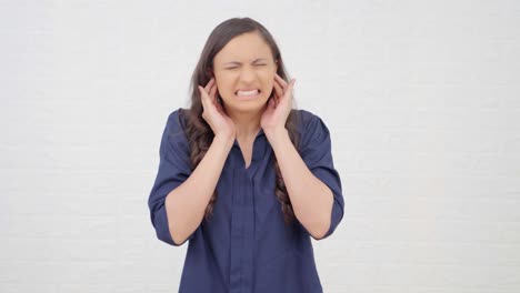 indian girl disturbed by loud noises