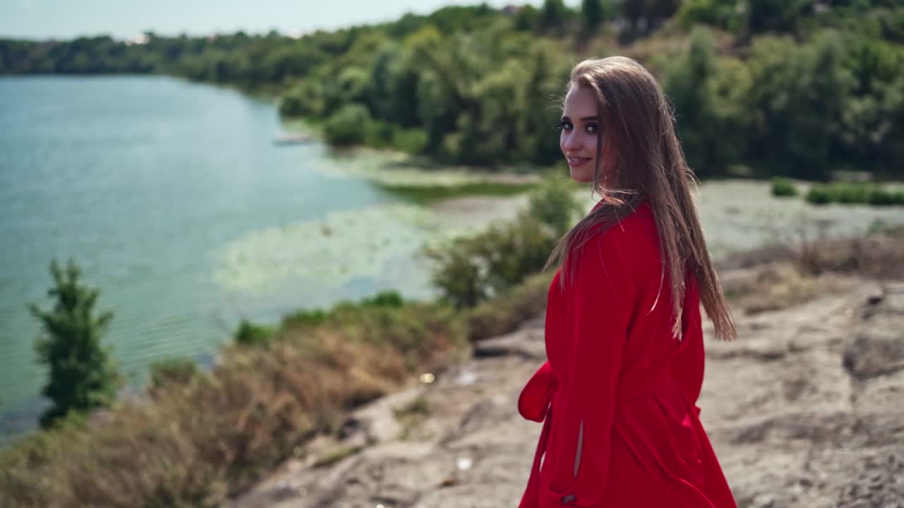 Woman relaxing in mountains. Carefree happy woman enjoying nature
