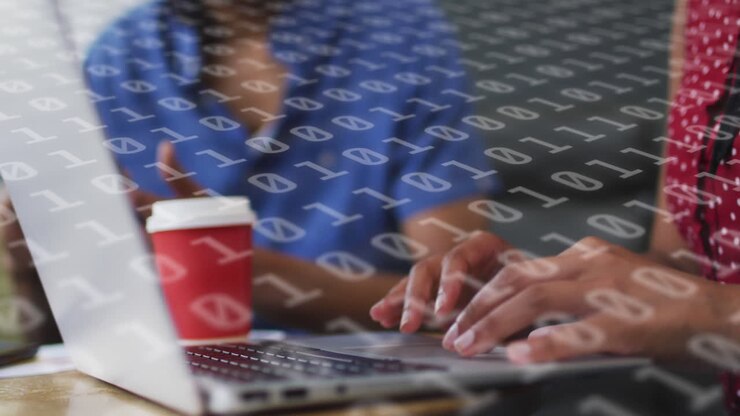 Animation of binary coding over diverse business people using laptop