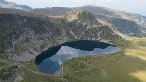 lake and mountain landscape at seven rila lakes in bulgaria - aerial 4k circling