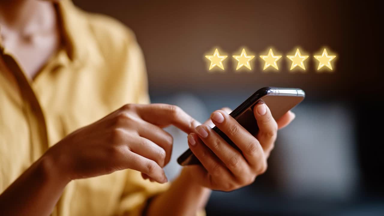 Customer feedback and rating with five stars on a smartphone