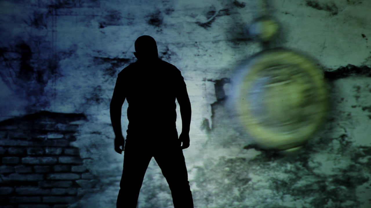 Silhouette of a person against an abstract wall