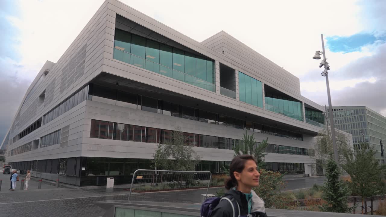 Modern architecture and urban landscape with a person walking in Norway
