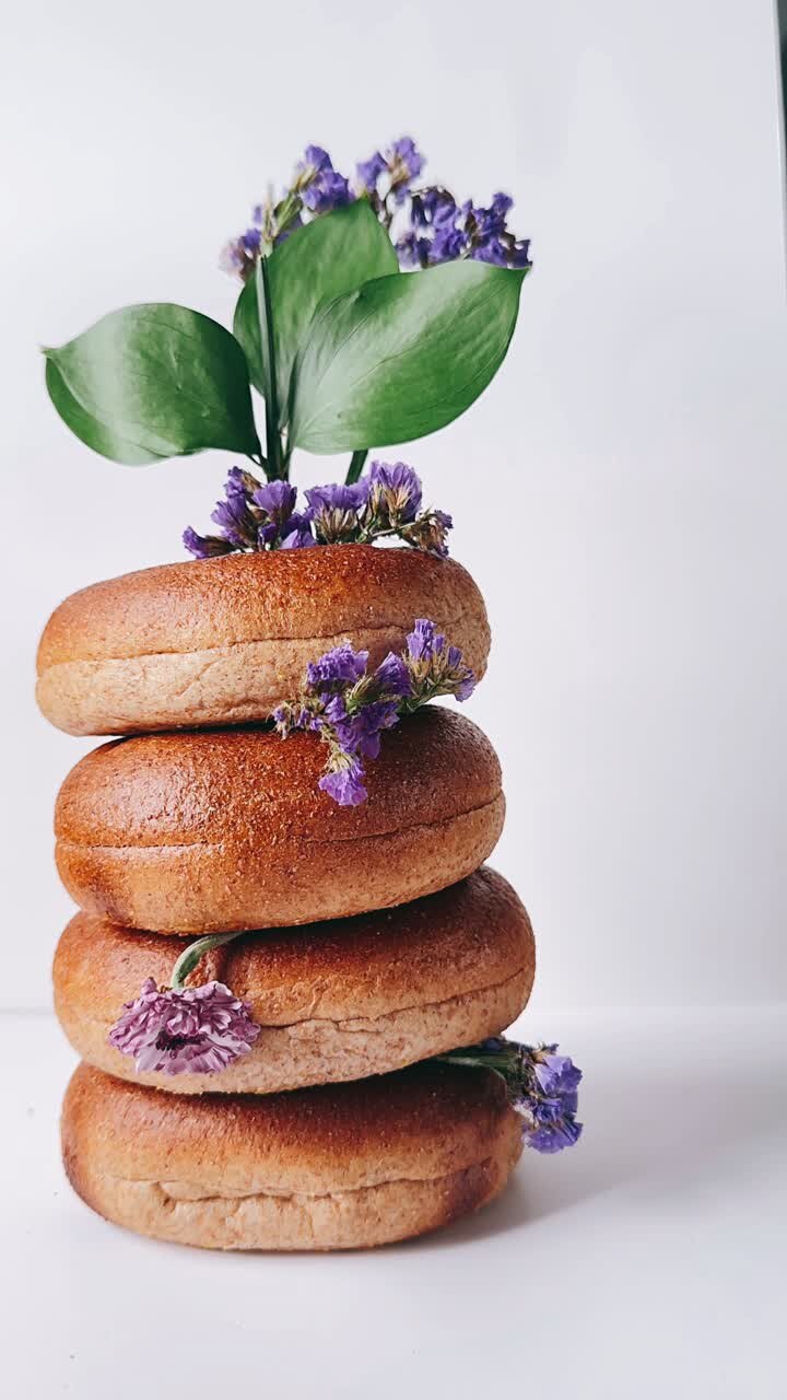 Stack of Bagels with Purple Flowers
