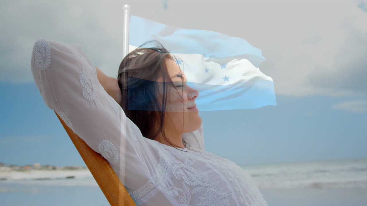 Woman relaxing on beach with Honduras flag animation overlaying scene