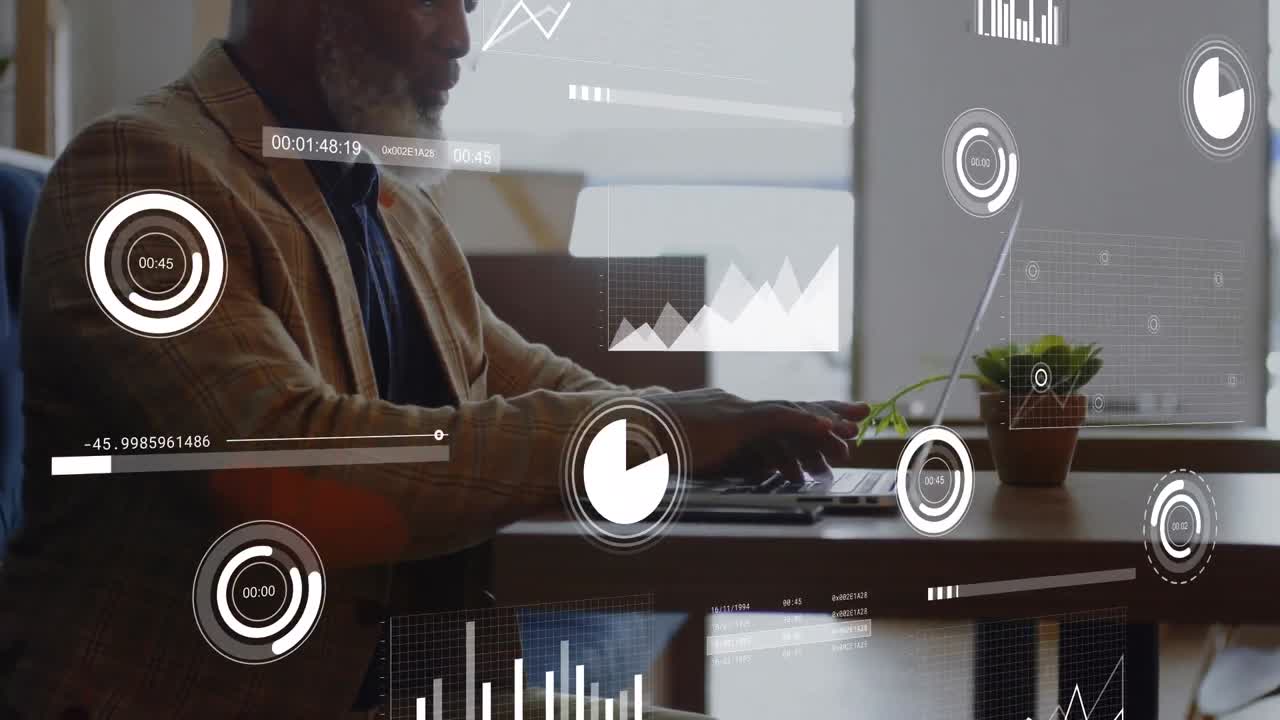 Animation of graphs, loading bars and circles over african american man working on laptop at office