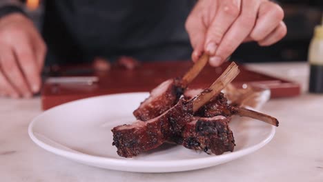 chef preparing grilled lamb ribs