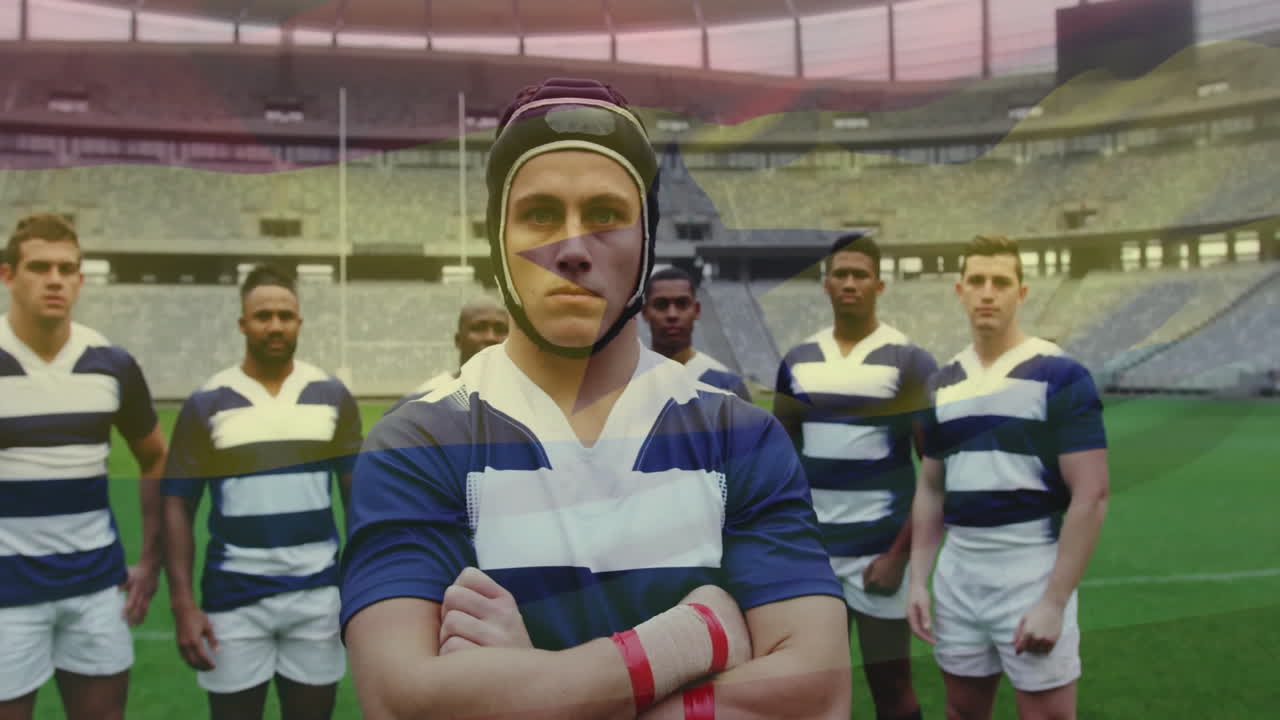 Standing confidently, rugby players in striped jerseys on stadium field