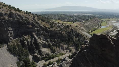 drone shot revealing the valleys lying beneath mount timpanogos in utah