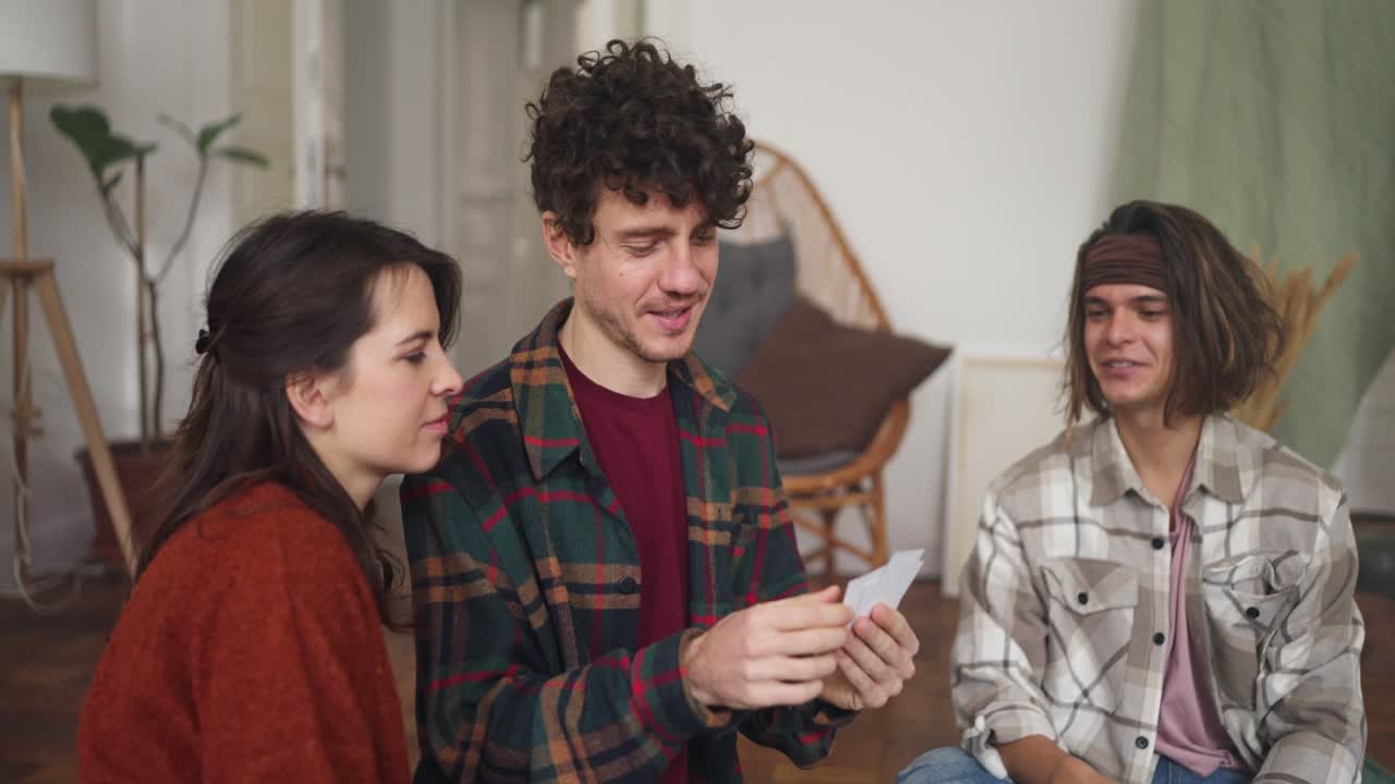 Friends Playing a Card Game at Home