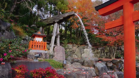 katsuoji temple in minoh osaka, slow motion waterfall and torii gate in autumn