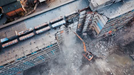 Urban Regeneration. Demolition of a building for new construction. Dismantling of a house. Aerial view