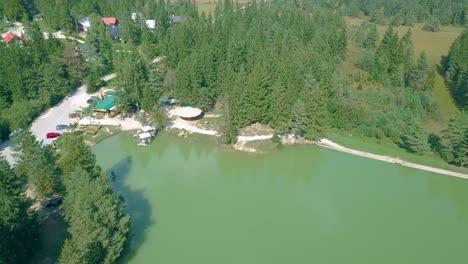 aerial view of the countryside with agricultural fields and a lake