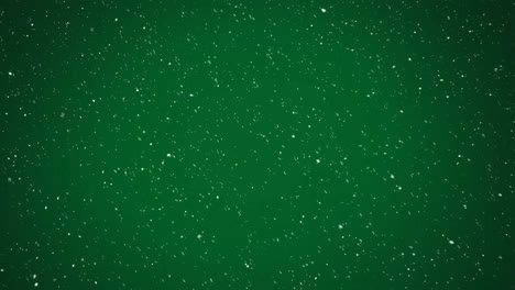 Animation-of-snow-falling-over-green-background