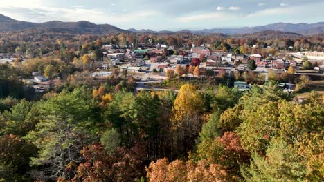 aerial high above franklin nc over the treetops in fall