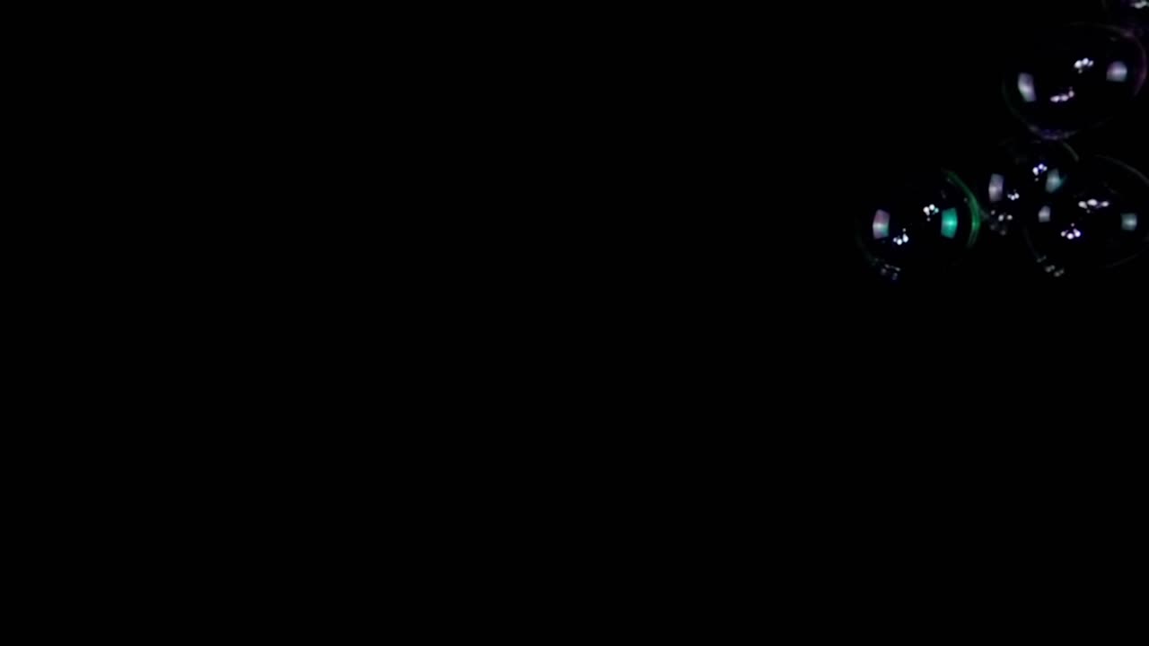 Colorful Soap Bubbles on Black Background