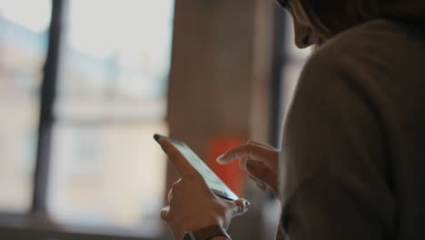 Close up of womans hands using smart phone technology