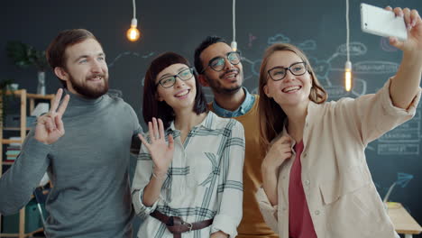 happy team selfie in modern office
