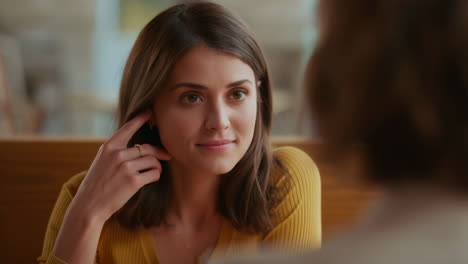 young woman engaged in conversation indoors