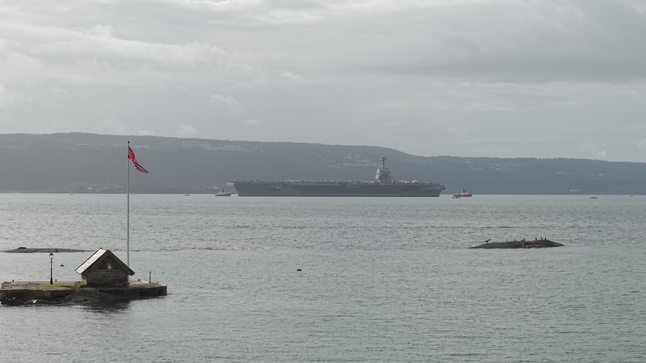 Oslo Fjord With USS Gerald R. Ford Aircraft Carrier Of the US Navy In Oslo, Norway. - wide shot