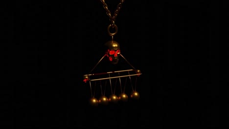 golden skull necklace with a pendulum