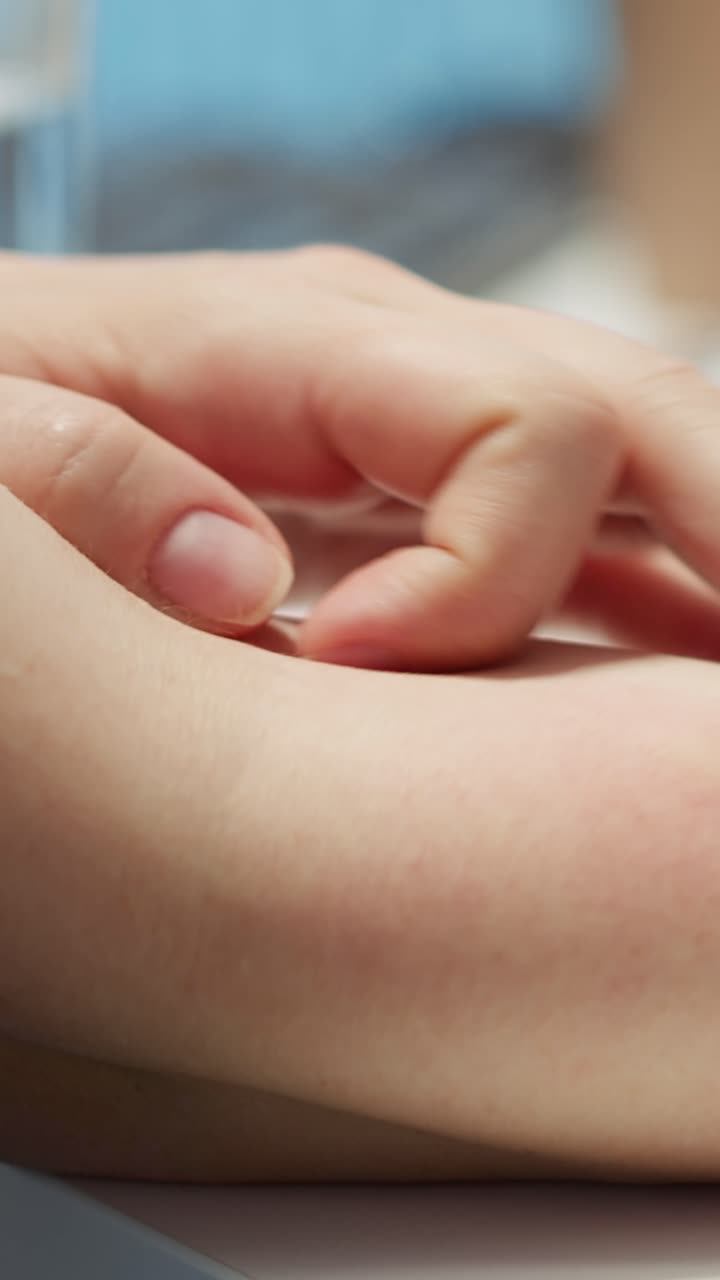 Close-up of Hand Scratching Itchy Arm