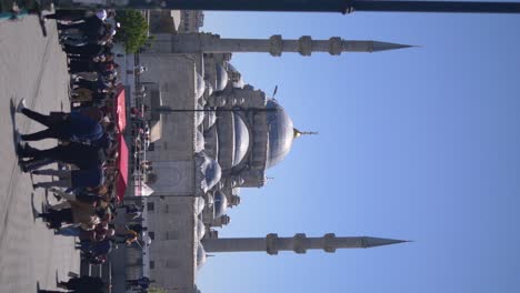 people walking in front of a mosque in istanbul