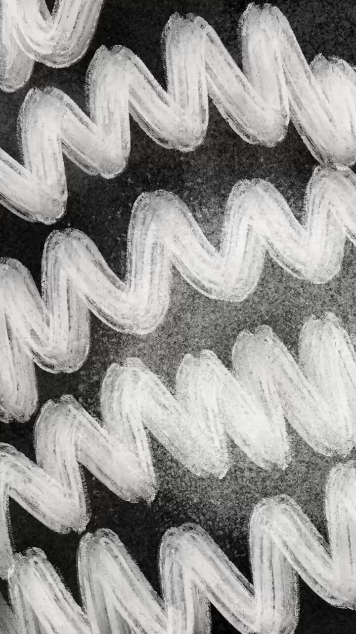 White Zigzag Lines Drawn with Chalk on Black Background