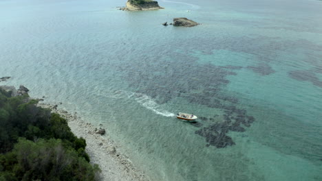 Drone-flying-over-marathonisi--in-Zakynthos,-Greece