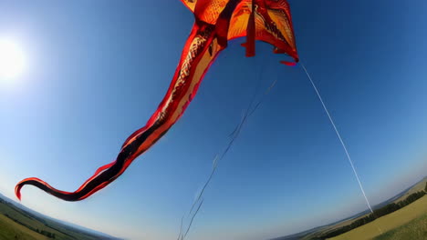 kite flying in a rural landscape