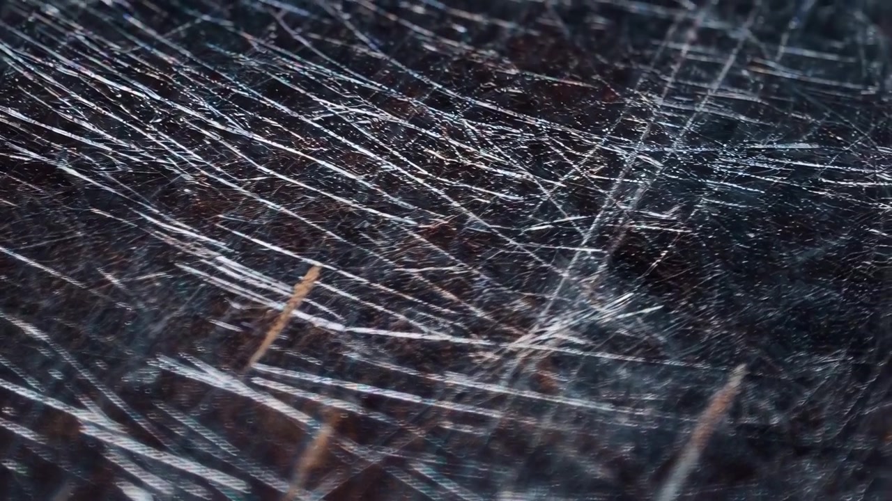 Macro View of Scratched Dark Metal Surface