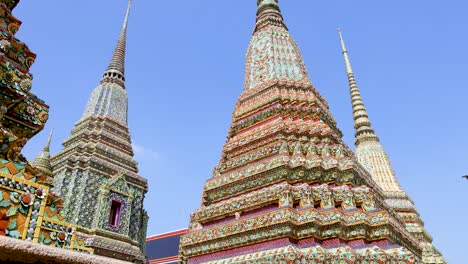 colorful stupas against clear sky at wat pho temple, bangkok