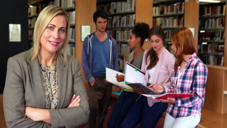 Students-and-tutor-discussing-in-the-library