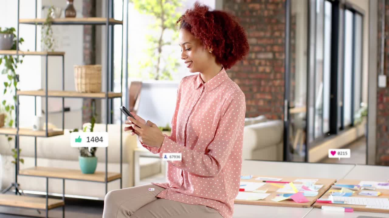 Woman tapping phone on desk, spawning social badges multiplying across loft while tracking growth