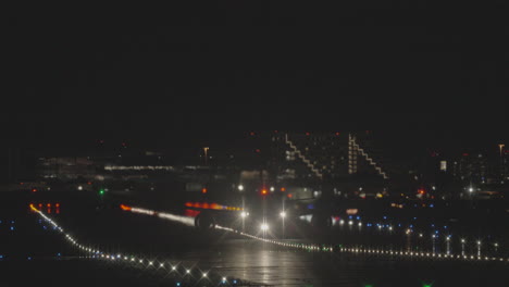 silhouette of a big airliner taking off from toronto pearson international airport at night