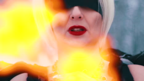 lady in phoenix suit red lipstick warms near fire in winter