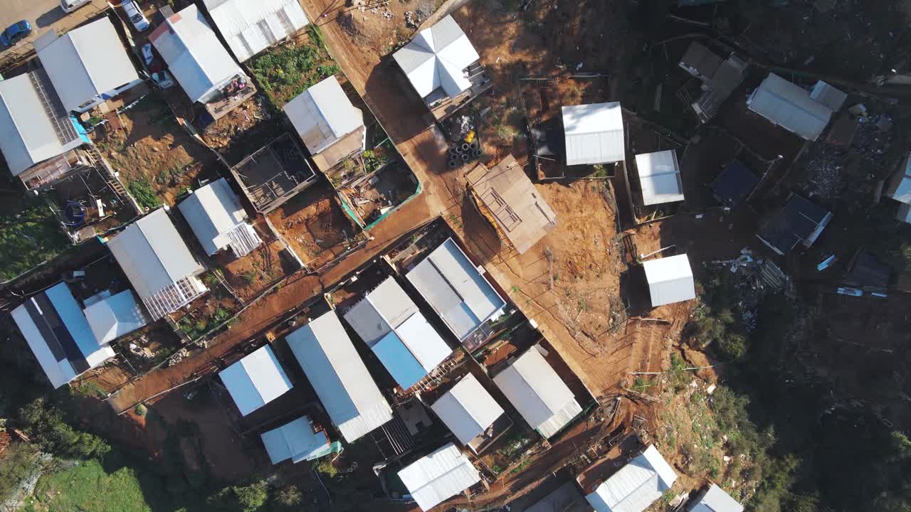 Top down drone shot flying over a less wealthy neighborhood of Valpara&iacute;so, Chile