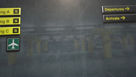 wall of airport with information texts for passengers