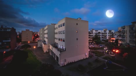 "Boomerang"-Loop-Compositing-of-a-day-and-night,-showing-a-building-and-people-out-at-night-talking-with-emojis