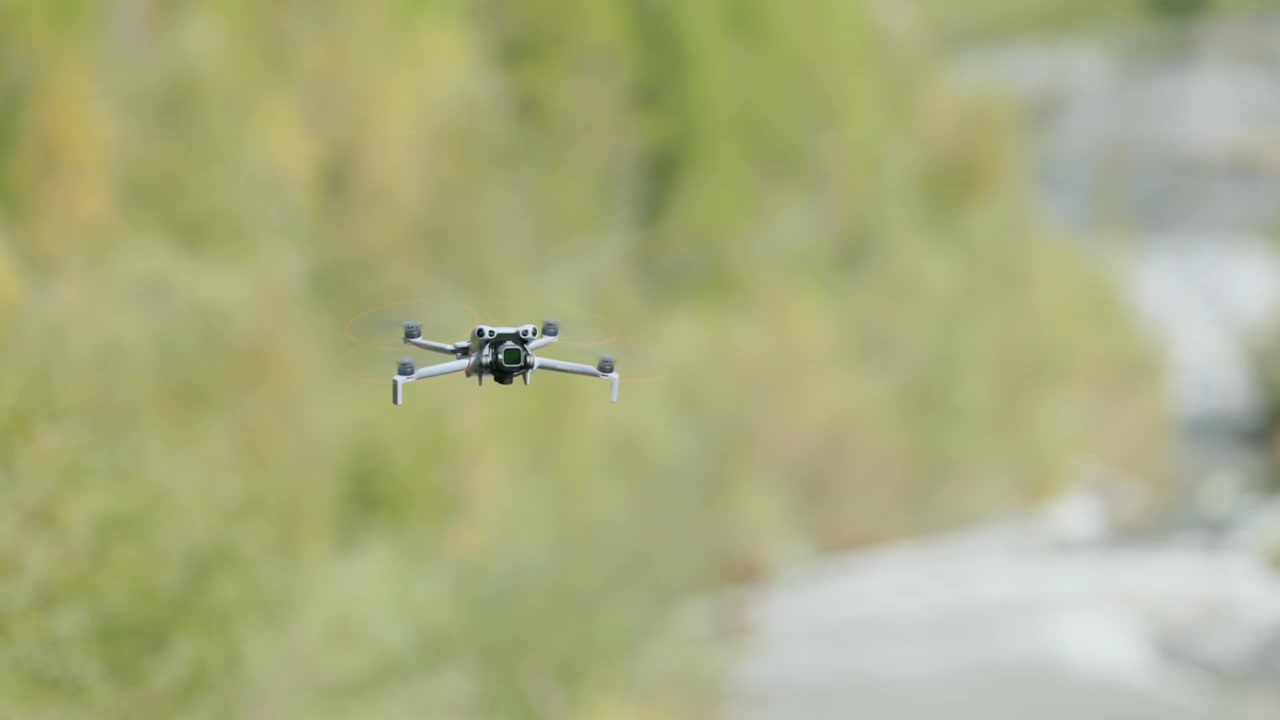DJI Mini 5 Pro Drone Flying Against A Natural Environment Background. Tracking Shot