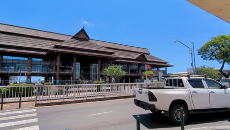 exterior street view of papeete port building and inner city traffic on waterfront road in papeete, tahiti, french polynesia